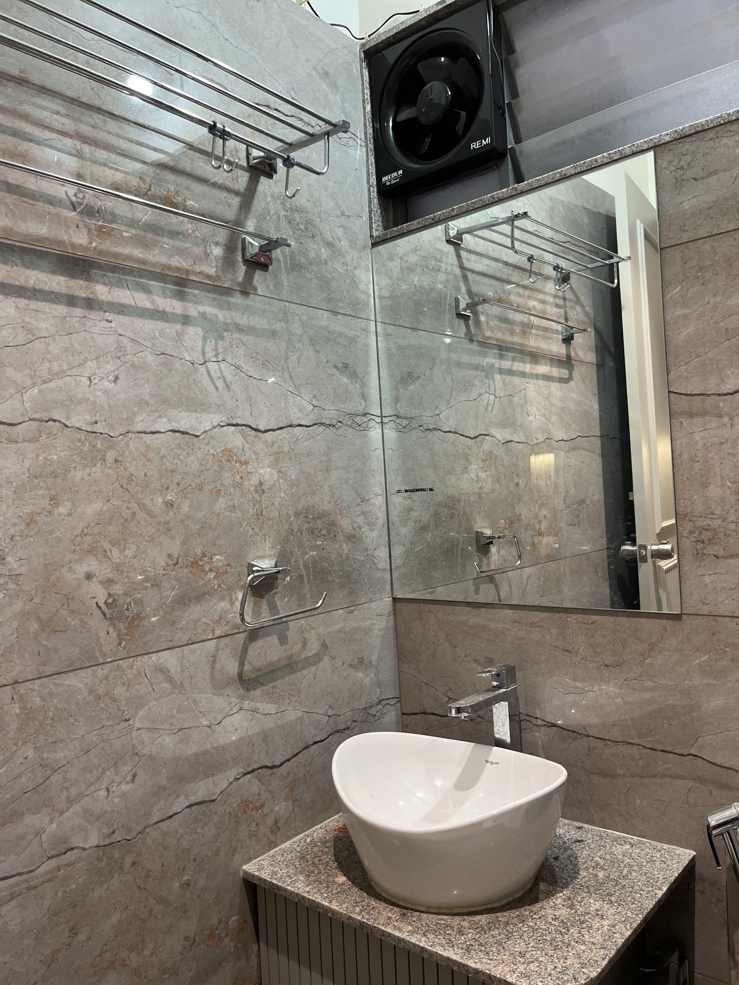 Bathroom — Stone-Clad Powder Room